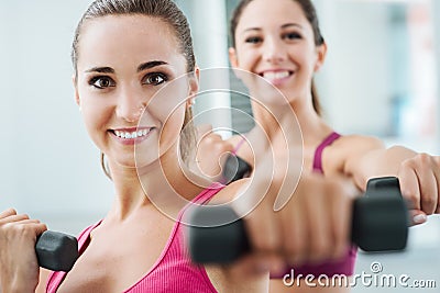 Cheerful women exercising at the gym Stock Photo