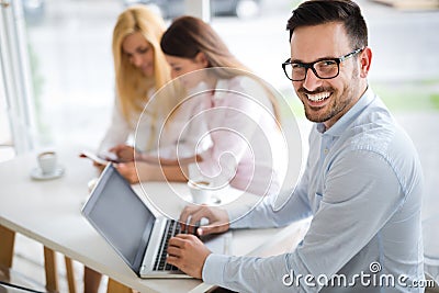 Workteam in office working together on laptop Stock Photo