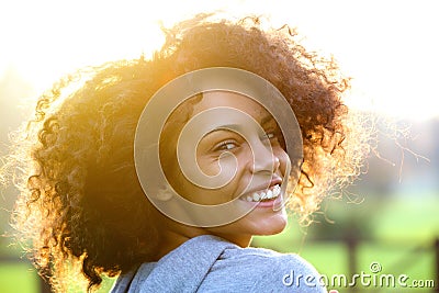 Cheerful young african american woman smiling outdoors Stock Photo