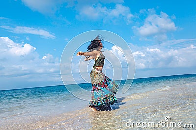 Cheerful young boho woman on the beach Stock Photo