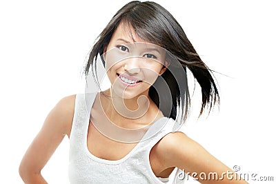 Cheerful young chinese girl with windswept hair Stock Photo