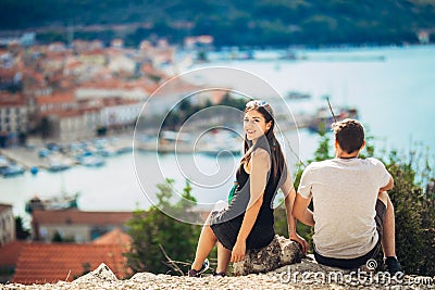 Cheerful young couple having a field trip date.Cityscape sightseeing,seaside travel vacation.Traveling in Europe Stock Photo