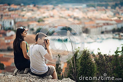 Cheerful young couple having a field trip date.Cityscape sightseeing,seaside travel vacation.Traveling in Europe Stock Photo