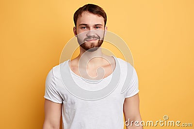 Cheerful young handsome being in high spirit , shares impressions Stock Photo