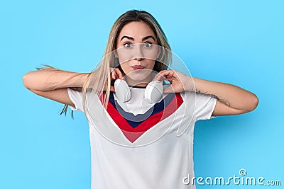 Funny woman putting on headphones Stock Photo