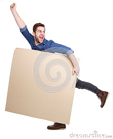 Cheerful young man holding blank poster Stock Photo