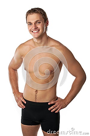 Cheerful young man in trunks over white Stock Photo