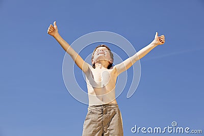 Cheering boy posing thumbs up Stock Photo