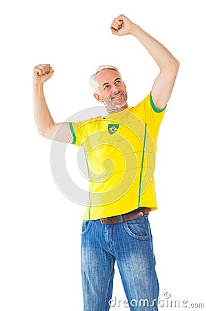 Cheering brazilian football fan in yellow Stock Photo