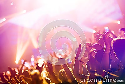 Cheering crowd at concert enjoying music performance Editorial Stock Photo