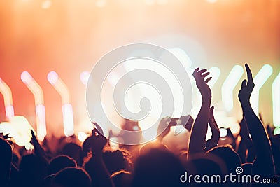 Cheering crowd with hands in air at music festival Stock Photo