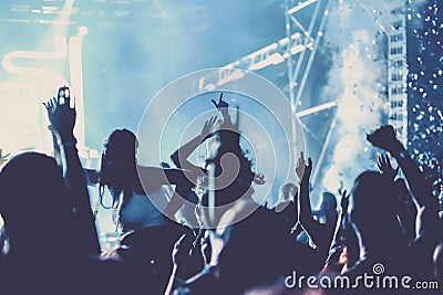 cheering crowd with raised hands at concert - music festival Editorial Stock Photo