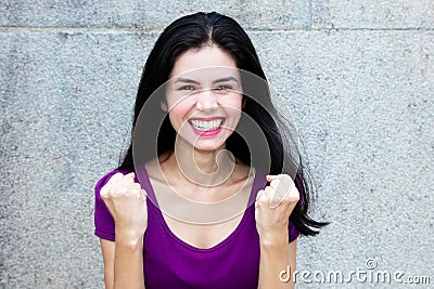 Cheering italian woman looking at camera Stock Photo