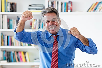 Cheering and laughing businessman with tie Stock Photo