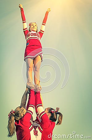 Cheerleaders in action on a vintage filtered look Stock Photo