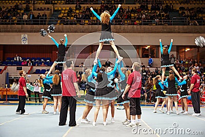 Cheerleaders girl team performs at Championship Editorial Stock Photo