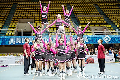 Cheerleaders girl team performs stunt Editorial Stock Photo