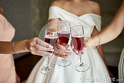 Cheers! Photo bride with her friends drinking champagne from glasses Stock Photo