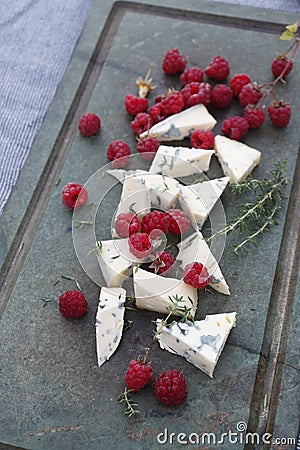 Cheese with blue mold and raspberry. Stock Photo