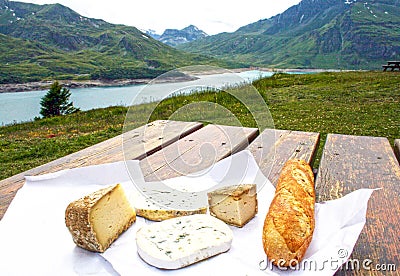 Cheese and bread, mountains and lake Stock Photo