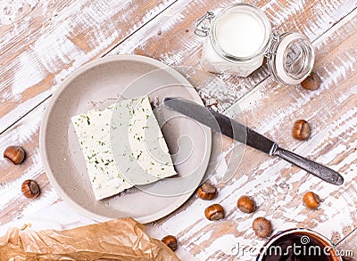 Cheese with dill and joghurt for breakfast on wooden table Stock Photo