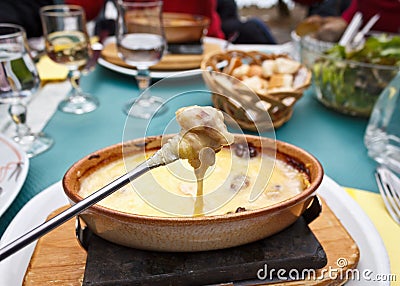 Cheese Fondue on a Fork Stock Photo