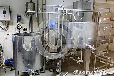 Cheese making machine in modern manufactory. Stock Photo