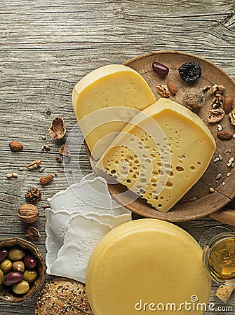 Hard Cheese snack with nuts, bread and wine Stock Photo