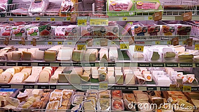 Cheese, mozzarella. Shelving fridge with edible products. Store. Editorial Stock Photo