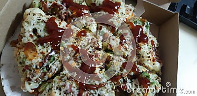 Cheese onion tomato chiken classic pizza with ketchup Stock Photo