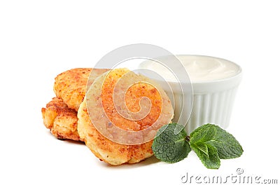 Cheese pancakes, sour cream and mint isolated on background Stock Photo