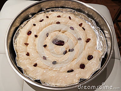 Cheese pie dough sprinkled with raisins Stock Photo