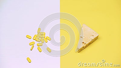 Cheese and pills, pasteurized products with organic bacteria, lactose, macro Stock Photo