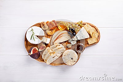 Cheese plate with blue cheese, brie, truffle hard cheese Stock Photo