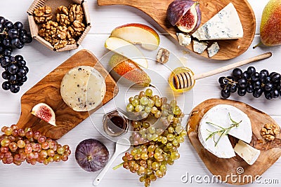 Cheese plate with blue cheese, brie, truffle hard cheese Stock Photo