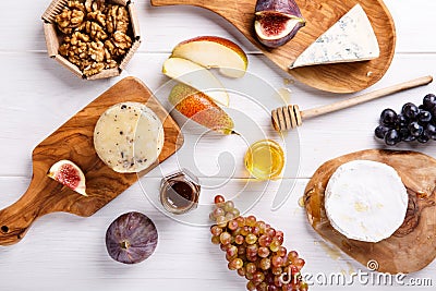Cheese plate with blue cheese, brie, truffle hard cheese Stock Photo