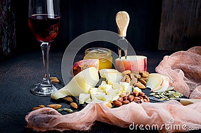 Cheese platter and glass of red wine Stock Photo