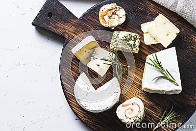 Cheese platter on white table. Stock Photo