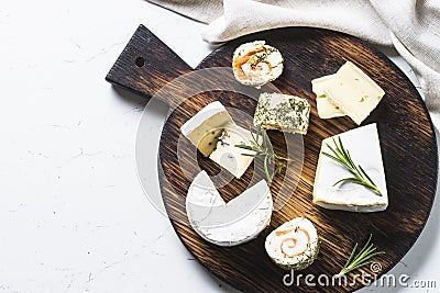 Cheese platter on white table. Stock Photo