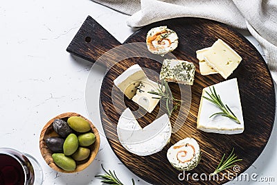 Cheese platter on white table. Stock Photo
