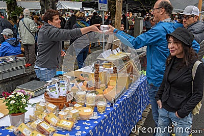 Cheese seller at the autumn market at Engelberg on the Swiss alps Editorial Stock Photo