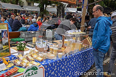 Cheese seller at the autumn market at Engelberg on the Swiss alps Editorial Stock Photo