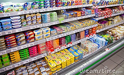 Cheese on shelves of local Russian supermarket. Editorial Stock Photo