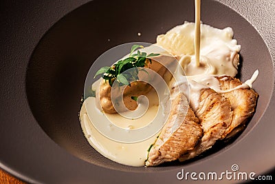 Cheese soup with turkey fillet. restaurant food. author menu Stock Photo