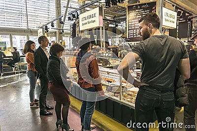 Cheese, wine, pasta outlets at the Bacalan market in Bordeaux Editorial Stock Photo