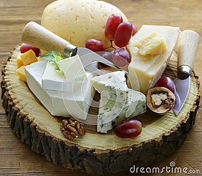 Cheeseboard with assorted cheeses Stock Photo