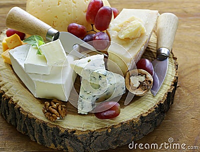 Cheeseboard with assorted cheeses Stock Photo