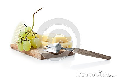 Cheeseboard of hard and blue cheese with grapes Stock Photo