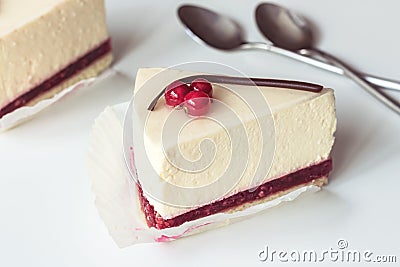 Cheesecake with red currant and chocolate strip, serving slices Stock Photo