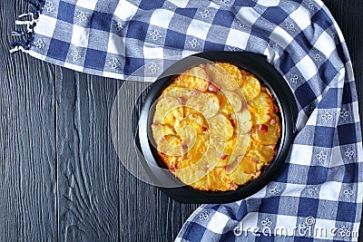 Cheesy, creamy potato au gratin with ham Stock Photo